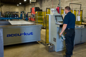 A Matot employee tests that quality of metal during the dumbwaiter manufacturing process.