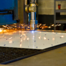 Close-up of a dumbwaiter being welded by a welding machine.