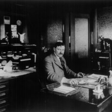 Matot's original founder shown in his office, in black and white.