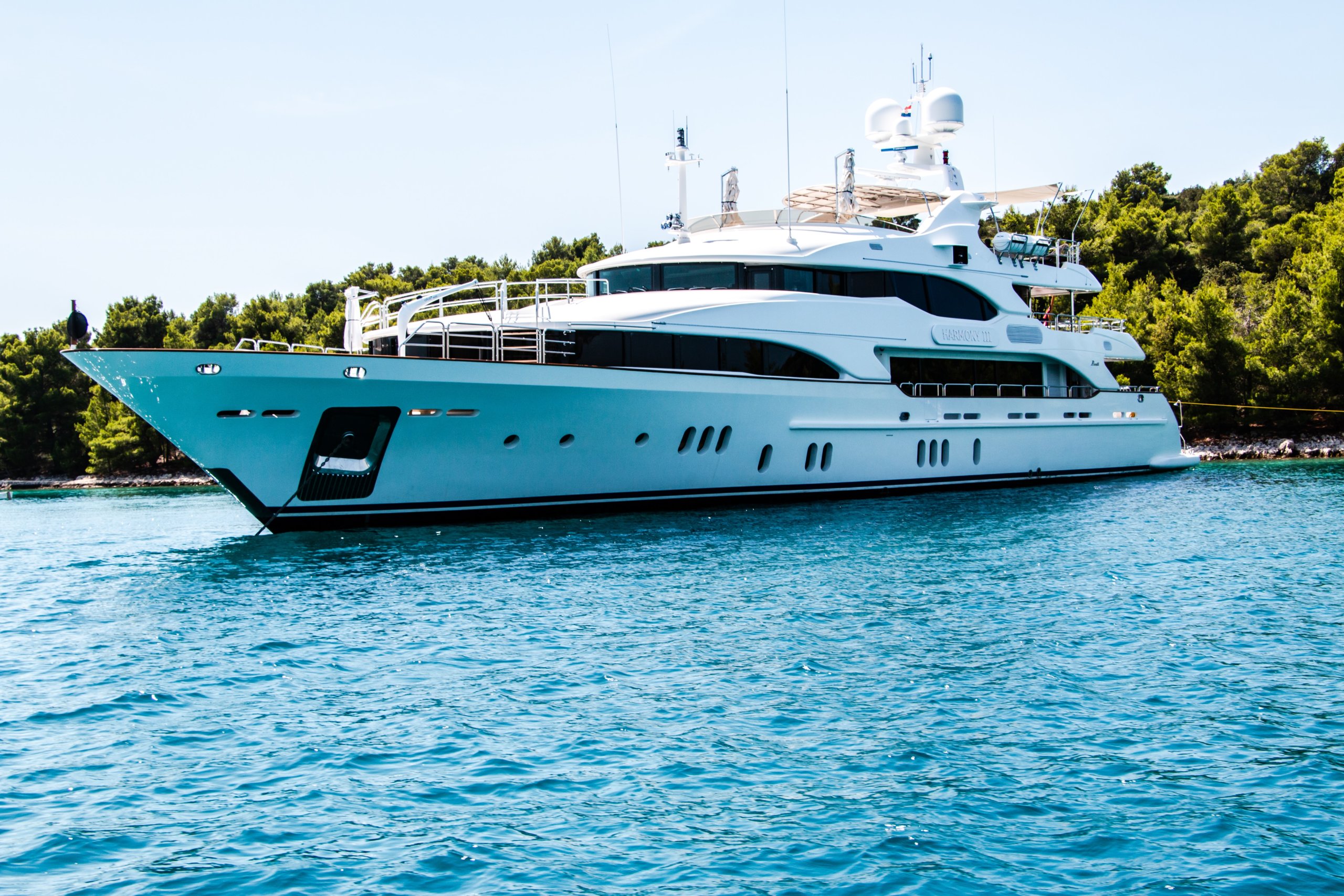 A luxurious Yacht shown on crystal clear water, home to one of Matot's high-quality dumbwaiters.